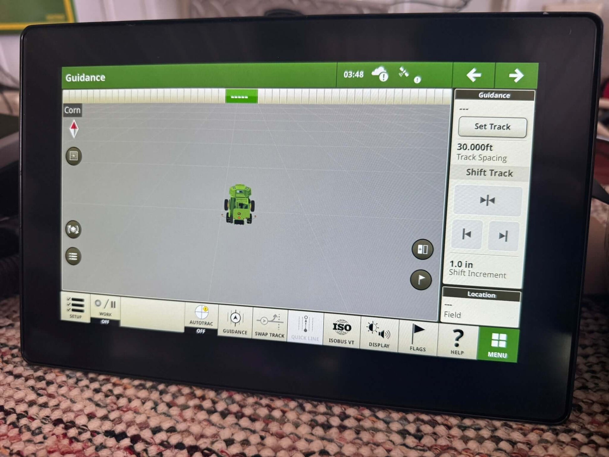 Front view of John Deere G5 Universal Display with AutoTrac activation