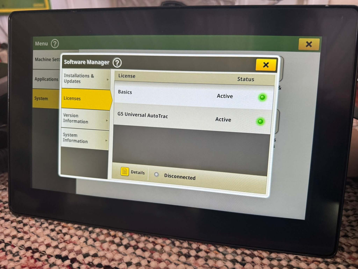 Front view of John Deere G5 Universal Display with AutoTrac activation and Serial Number