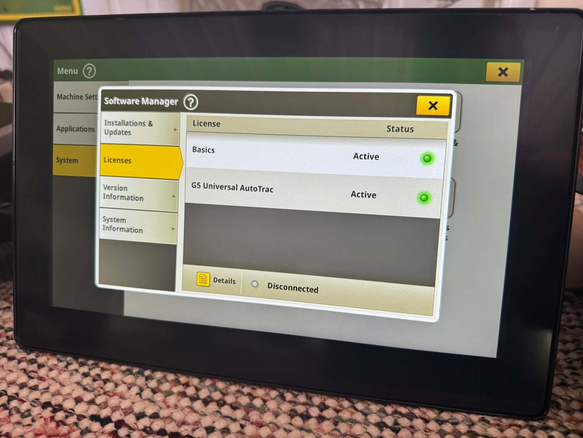 Front view of John Deere G5 Universal Display with AutoTrac activation and Serial Number